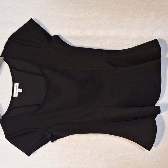 Roomates Tops - Black small blouse with ruffle bottom.